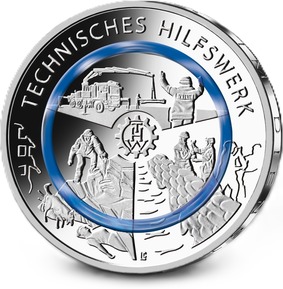 Die Bildseite stellt die menschlichen und die technischen Aspekte der Arbeit des Technischen Hilfswerks dar. Die Einsatzkräfte sind in ihrer Geschlechtlichkeit offen gestaltet, was dem Anspruch des Technischen Hilfswerks auf Vielseitigkeit entspricht. Die Darstellung der vielfältigen Tätigkeiten des Technischen Hilfswerks wird durch den blauen Polymerring sowie das zentral dargestellte Logo unterstützt.